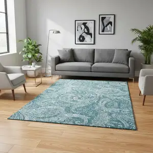Photo of Turquoise And Ivory Paisley Washable Area Rug With UV Protection