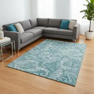 Photo of Turquoise And Ivory Paisley Washable Area Rug With UV Protection