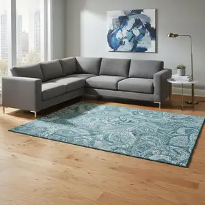 Photo of Turquoise And Ivory Paisley Washable Area Rug With UV Protection