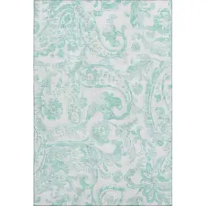 Photo of Turquoise And Ivory Paisley Washable Area Rug With UV Protection