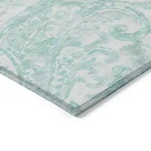 Photo of Turquoise And Ivory Paisley Washable Indoor Outdoor Area Rug