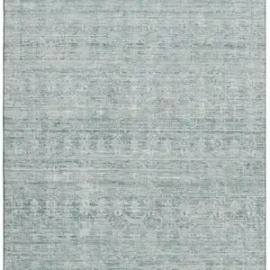 Photo of Turquoise And Ivory Striped Washable Area Rug With UV Protection