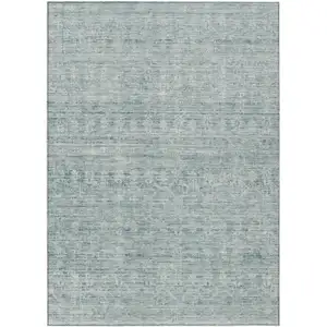 Photo of Turquoise And Ivory Striped Washable Indoor Outdoor Area Rug