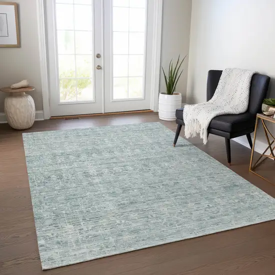 Turquoise And Ivory Striped Washable Indoor Outdoor Area Rug Photo 6