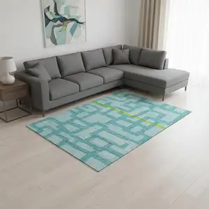Photo of Turquoise And Sky Blue Abstract Washable Area Rug With UV Protection