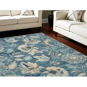 Photo of Turquoise Cream and Navy Blue Floral Distressed Area Rug