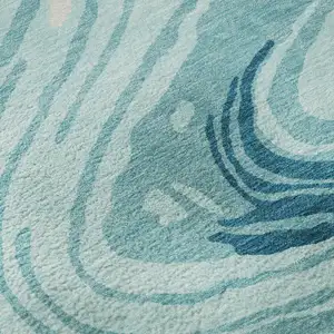 Photo of Turquoise Gray And Ivory Abstract Washable Area Rug With UV Protection