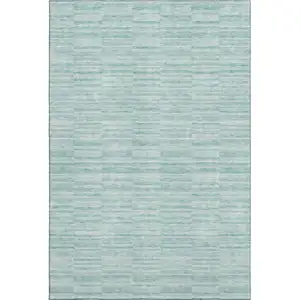 Photo of Turquoise Gray And Ivory Striped Washable Area Rug With UV Protection