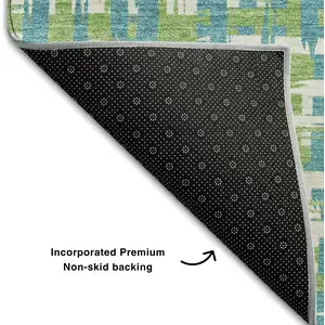 Photo of Turquoise Green And Ivory Abstract Geometric Washable Area Rug With UV Protection