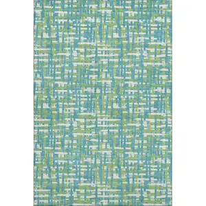 Photo of Turquoise Green And Ivory Abstract Geometric Washable Area Rug With UV Protection