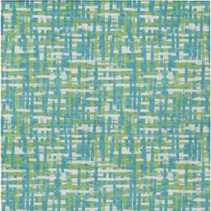 Photo of Turquoise Green And Ivory Abstract Washable Indoor Outdoor Area Rug