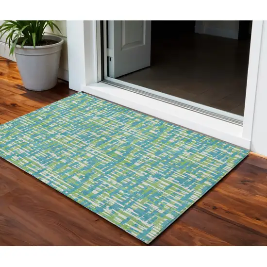 Turquoise Green And Ivory Abstract Washable Indoor Outdoor Area Rug Photo 1