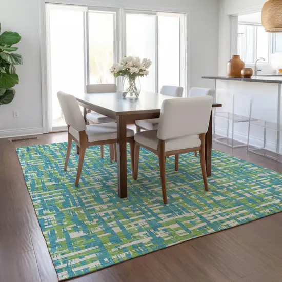 Turquoise Green And Ivory Abstract Washable Indoor Outdoor Area Rug Photo 9