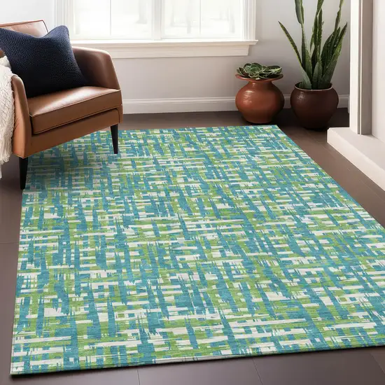 Turquoise Green And Ivory Abstract Washable Indoor Outdoor Area Rug Photo 9