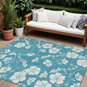 Photo of Turquoise Ivory And Gray Floral Washable Indoor Outdoor Area Rug