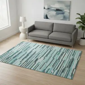 Photo of Turquoise Teal Blue And Gray Abstract Washable Area Rug With UV Protection