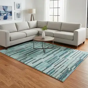 Photo of Turquoise Teal Blue And Gray Abstract Washable Area Rug With UV Protection