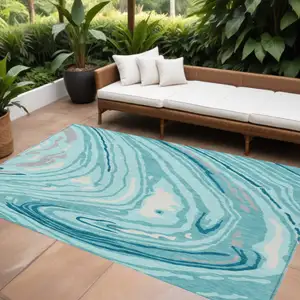 Photo of Turquoise Teal Blue And Gray Abstract Washable Indoor Outdoor Area Rug