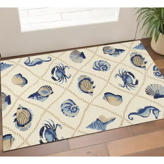 Sand Beige And Blue Fish Hand Tufted Area Rug Photo 1