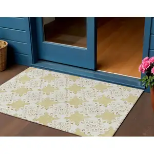 Photo of Wheat And Ivory Quatrefoil Washable Indoor Outdoor Area Rug