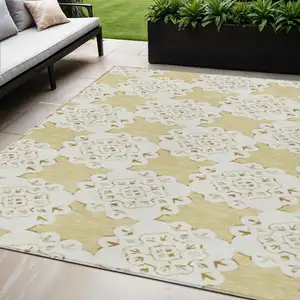 Photo of Wheat And Ivory Quatrefoil Washable Indoor Outdoor Area Rug