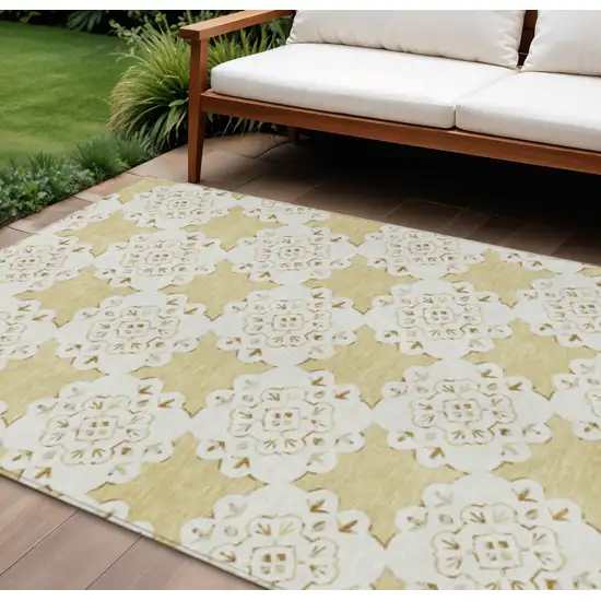 Wheat And Ivory Quatrefoil Washable Indoor Outdoor Area Rug Photo 1