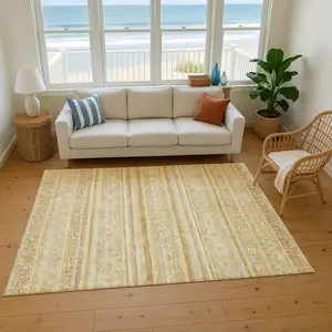 Photo of Wheat Beige And Gold Striped Washable Area Rug With UV Protection