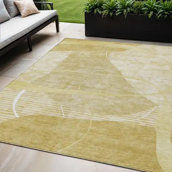 Wheat Gold And Ivory Abstract Washable Indoor Outdoor Area Rug Photo 1