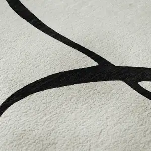 Photo of White And Black Abstract Washable Area Rug With UV Protection