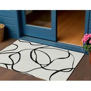 Photo of White And Black Abstract Washable Indoor Outdoor Area Rug
