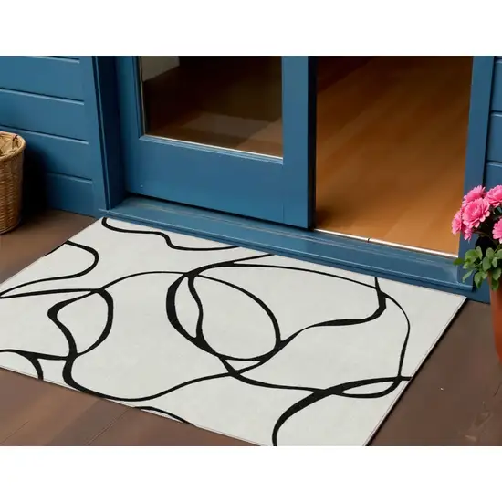 White And Black Abstract Washable Indoor Outdoor Area Rug Photo 1