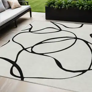 Photo of White And Black Abstract Washable Indoor Outdoor Area Rug