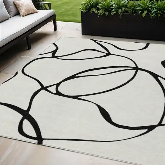 White And Black Abstract Washable Indoor Outdoor Area Rug Photo 1