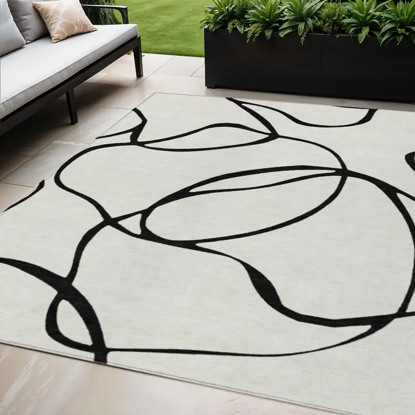 White And Black Abstract Washable Indoor Outdoor Area Rug Photo 1
