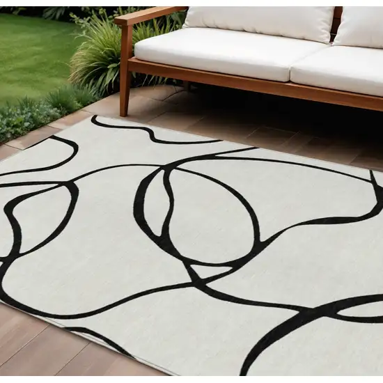 White And Black Abstract Washable Indoor Outdoor Area Rug Photo 1