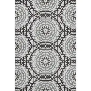 Photo of White And Black Geometric Washable Area Rug With UV Protection
