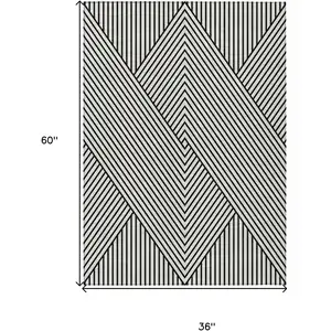Photo of White And Black Geometric Washable Indoor Outdoor Area Rug
