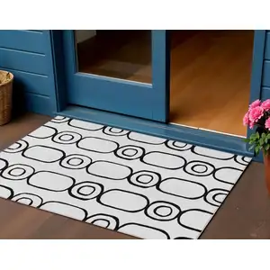 Photo of White And Black Geometric Washable Indoor Outdoor Area Rug