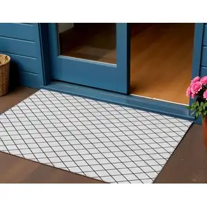 Photo of White And Black Geometric Washable Indoor Outdoor Area Rug