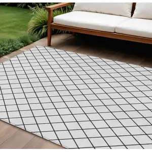 Photo of White And Black Geometric Washable Indoor Outdoor Area Rug