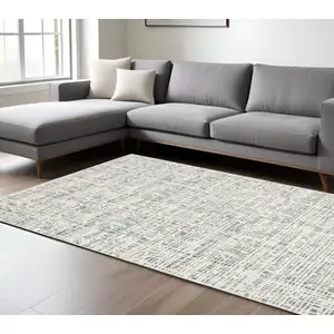 Photo of White And Grey Abstract Power Loom Stain Resistant Area Rug