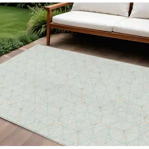 Photo of White Aqua And Copper Geometric Washable Indoor Outdoor Area Rug