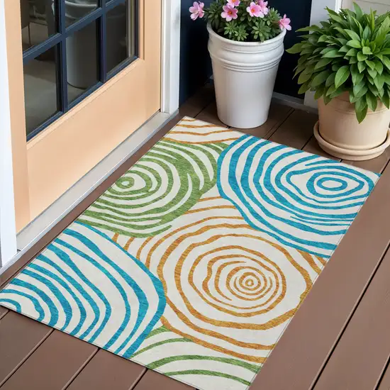 White Orange And Teal Blue Abstract Washable Indoor Outdoor Area Rug Photo 1
