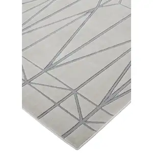 Photo of White Silver And Gray Geometric Stain Resistant Area Rug