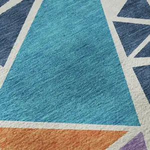 Photo of White Teal Pink And Orange Geometric Washable Area Rug With UV Protection