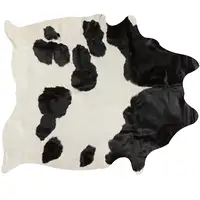 Photo of White and Black Cowhide Rug
