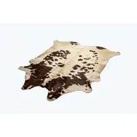 Photo of White and Brown Cowhide Rug