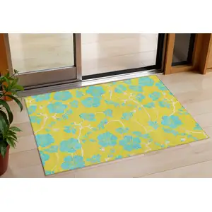 Photo of Yellow And Aqua Floral Washable Indoor Outdoor Area Rug