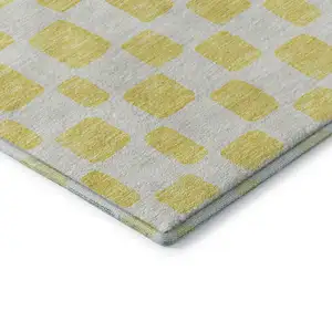 Photo of Yellow And Beige Geometric Washable Area Rug With UV Protection