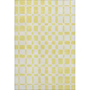 Photo of Yellow And Beige Geometric Washable Area Rug With UV Protection